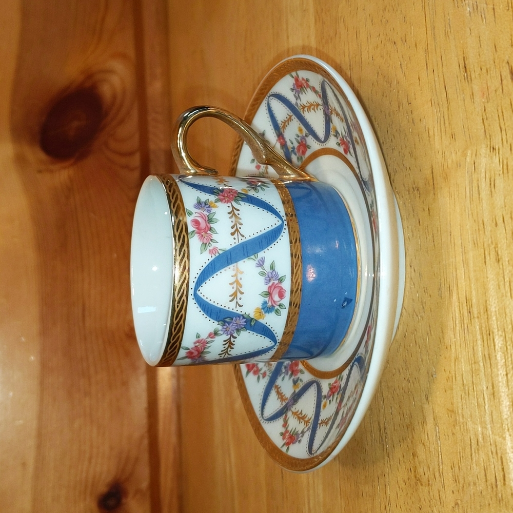 A special place demitasse tea cup and saucer gold trim